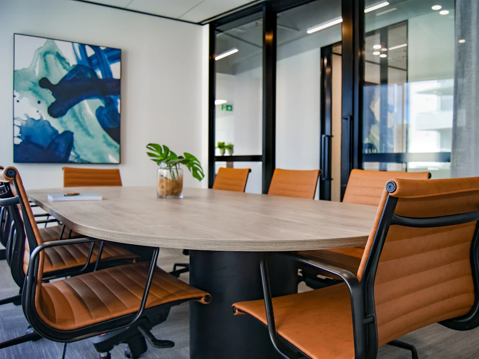 Modern meeting room with a large table prepared for a strategy session
